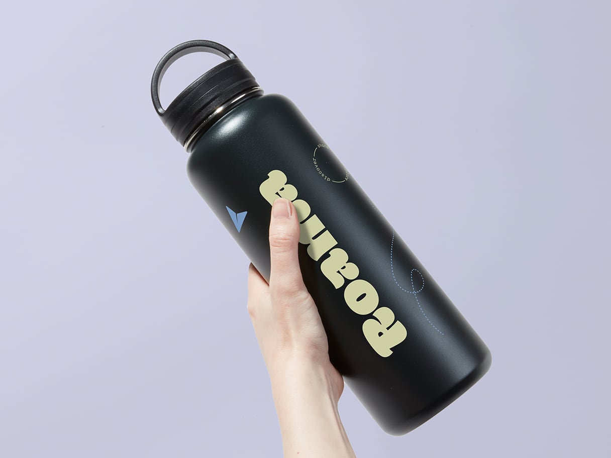 A person holding a large water bottle.